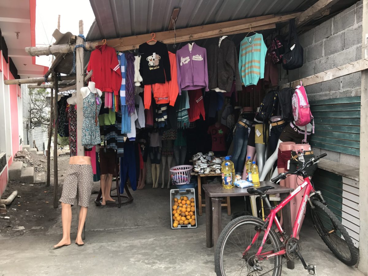 Clothes, oranges and vegetable oil for sale