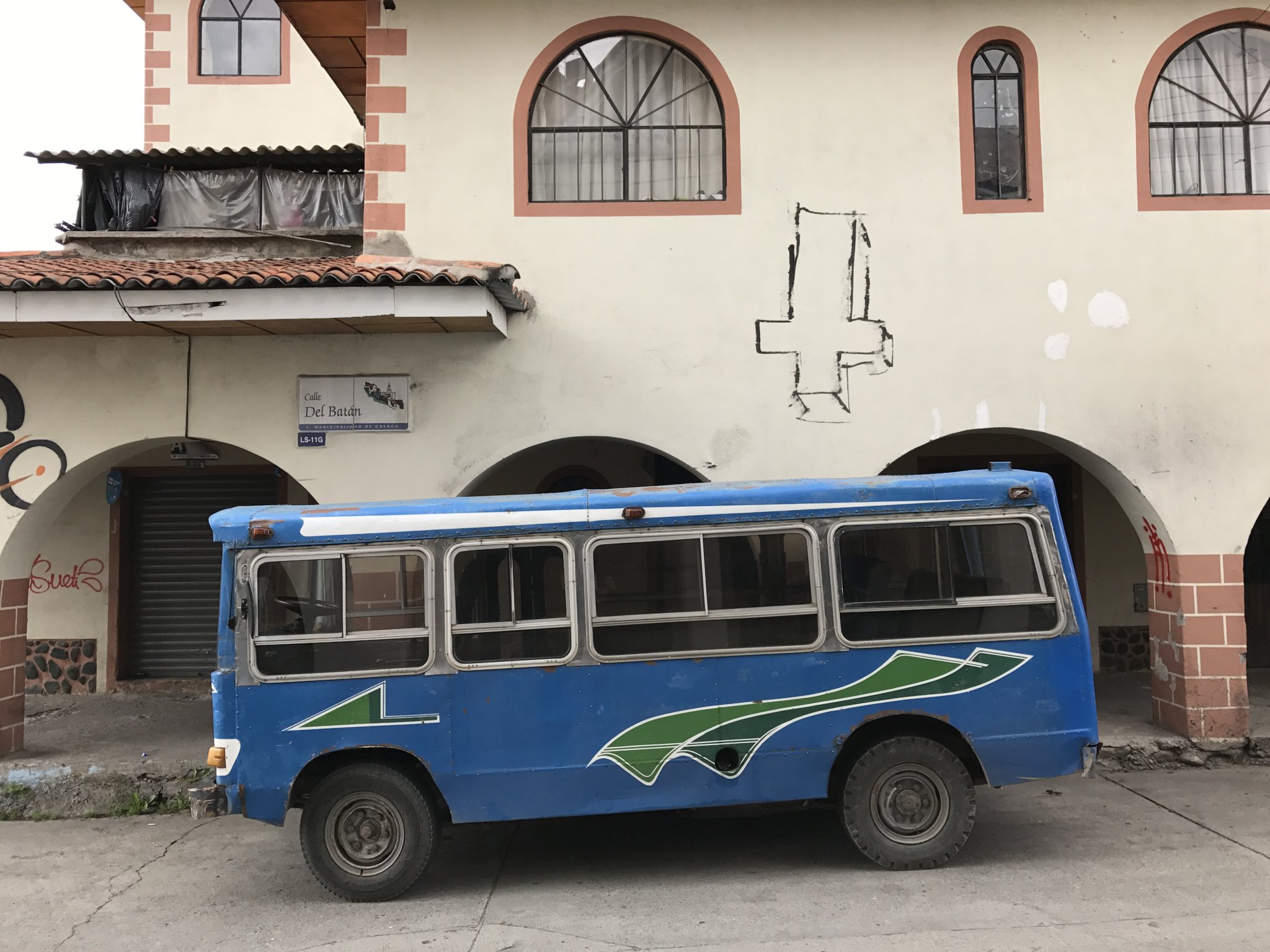 Cool old bus and strange graffiti, central Cuenca