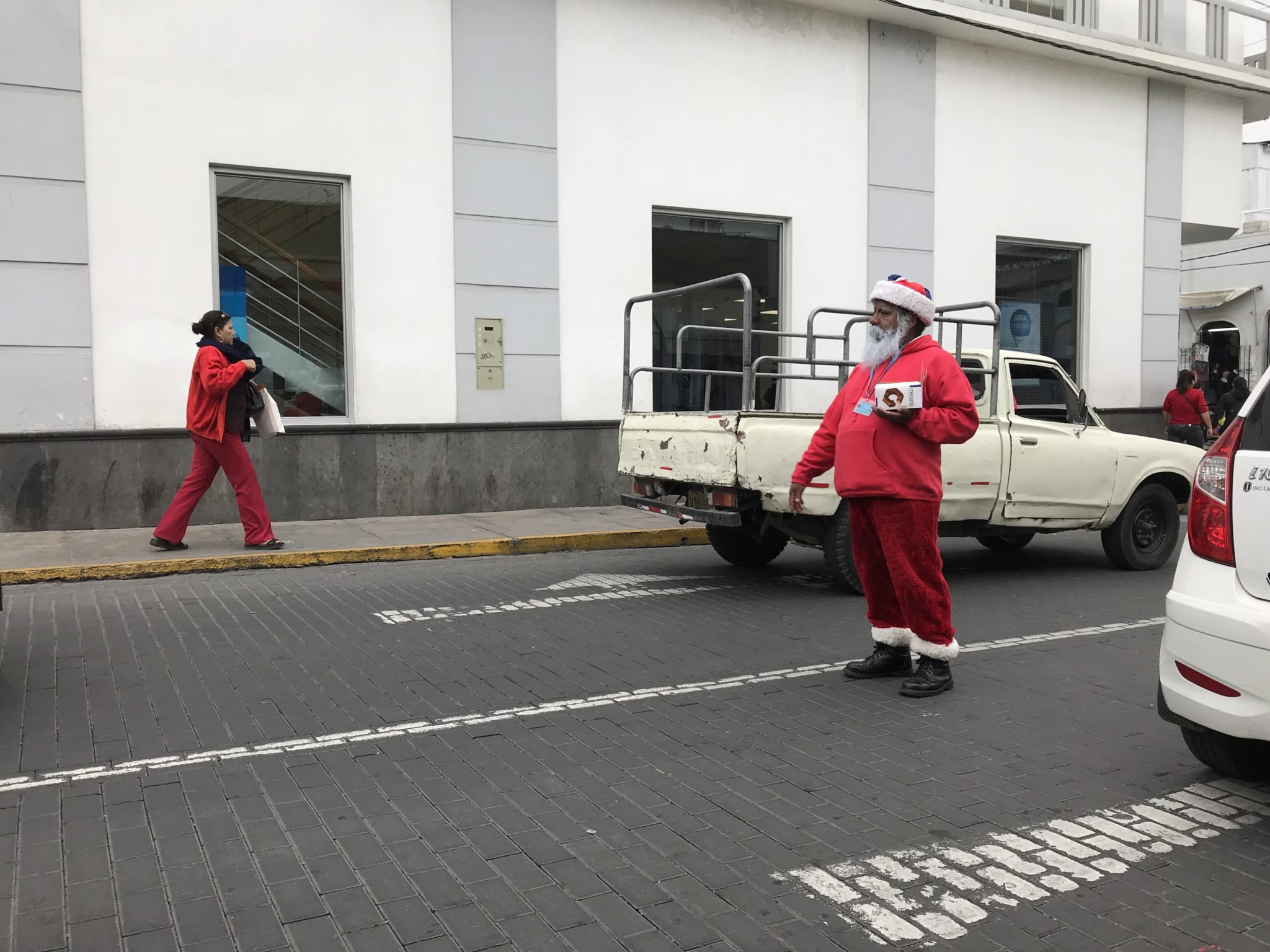 Santa collecting on the street in early January, Arequipa, Peru